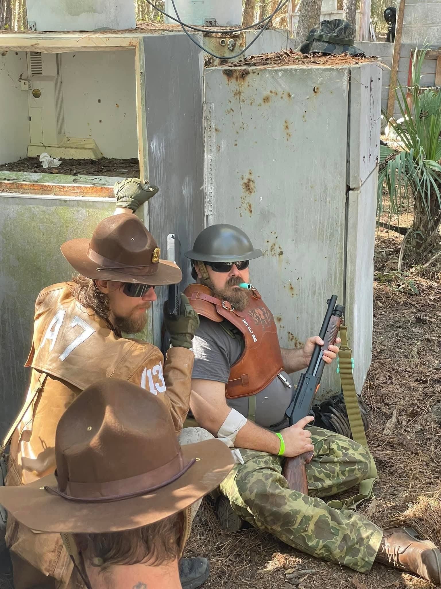NCR soldiers taking cover at a rusted structure during a MindGame Productions event